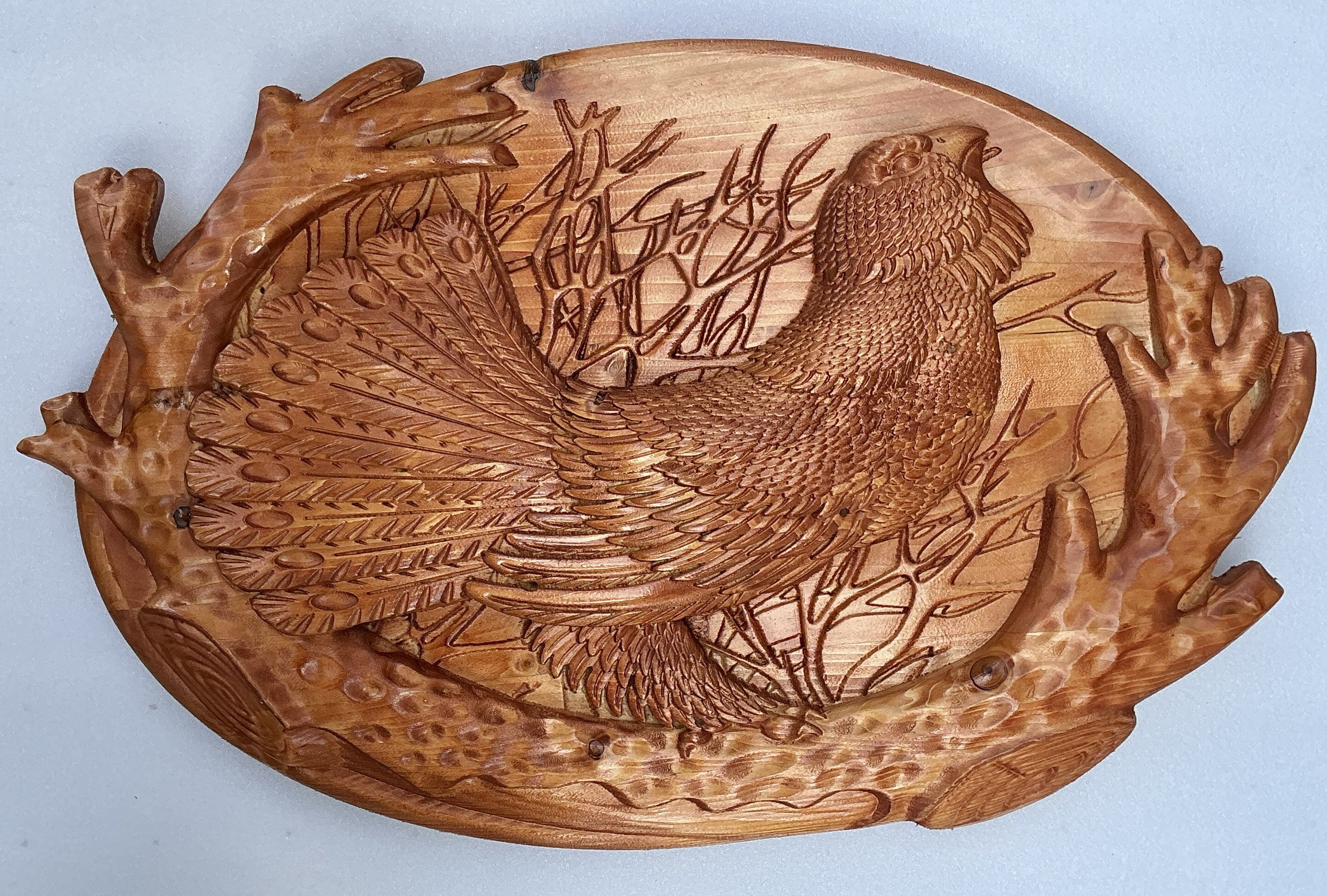 Wooden relief painting – grouse among forest branches, oval panel